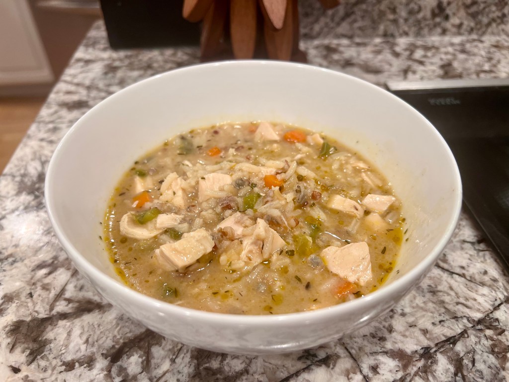 Creamy chicken and wild rice soup served in a bowl, ready to eat