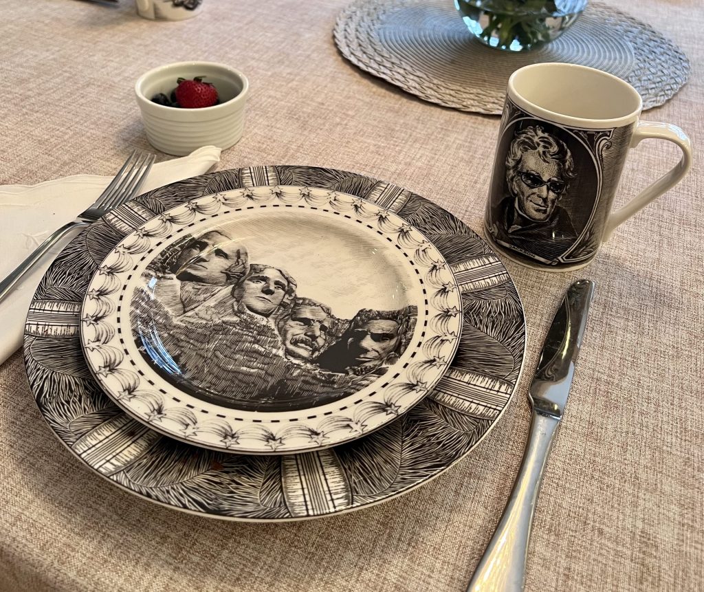 Cool Jackson mug paired with Mt. Rushmore salad plate from the 222 Fifth Slice of Life collection set on a President’s Day breakfast table