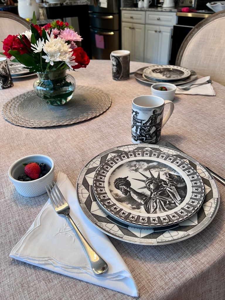 Statue of Liberty salad plate paired with the Army Men mug from the 222 Fifth Slice of Life collection styled for a President’s Day breakfast table
