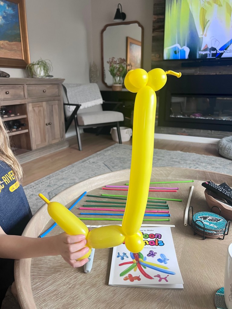 Balloon giraffe shape created from twisted balloon before decorating with marker