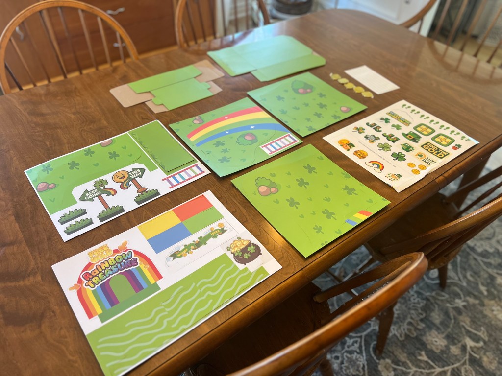 Leprechaun trap craft kit supplies laid out on a table ready for a St. Patrick’s Day kids activity