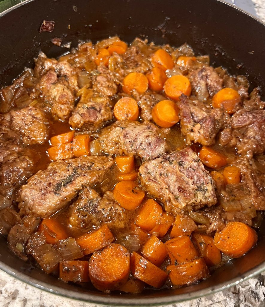 Hearty Guinness Irish stew in a Staub Dutch oven with tender beef and a rich, flavorful broth