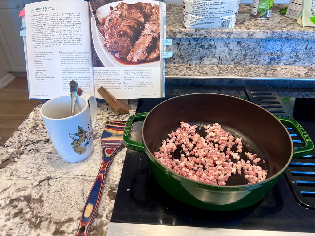 Pancetta cooking in Dutch oven for Barolo braised beef, rendering fat to build rich red wine sauce flavor